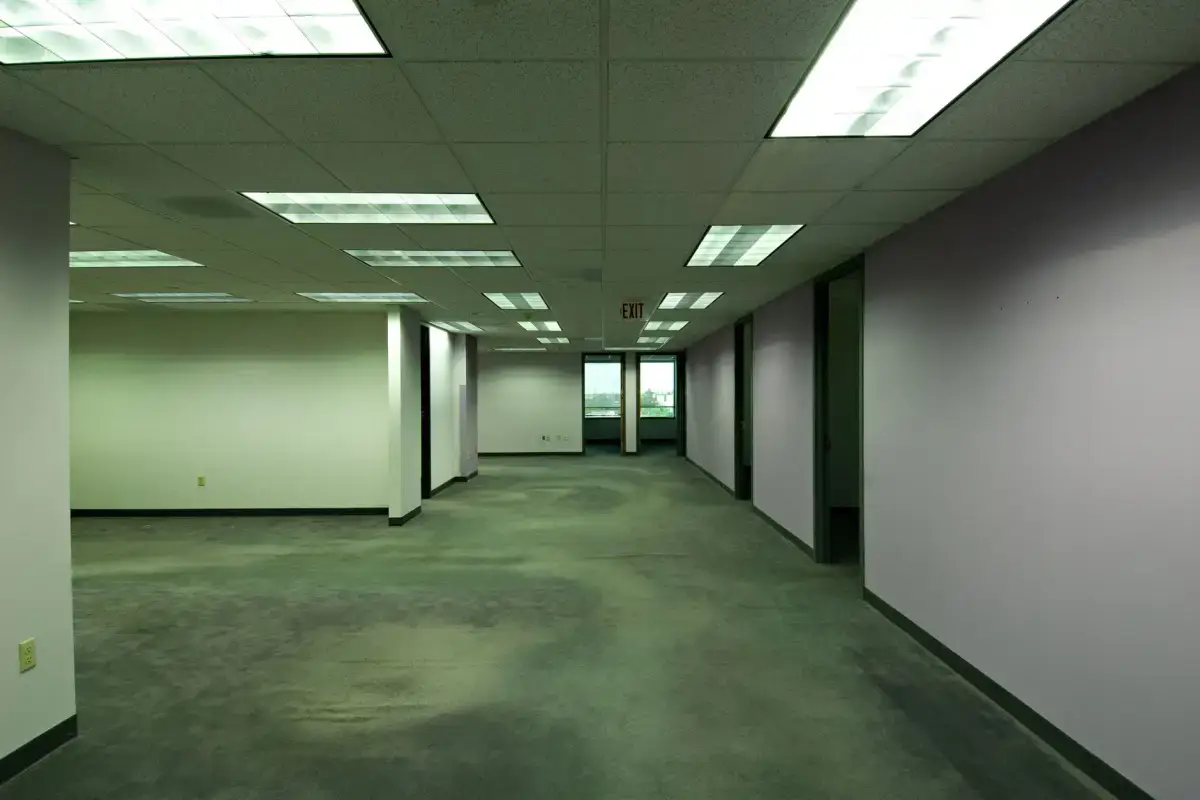 Empty commercial office interior with boarded walls ready for finishing to a specified level