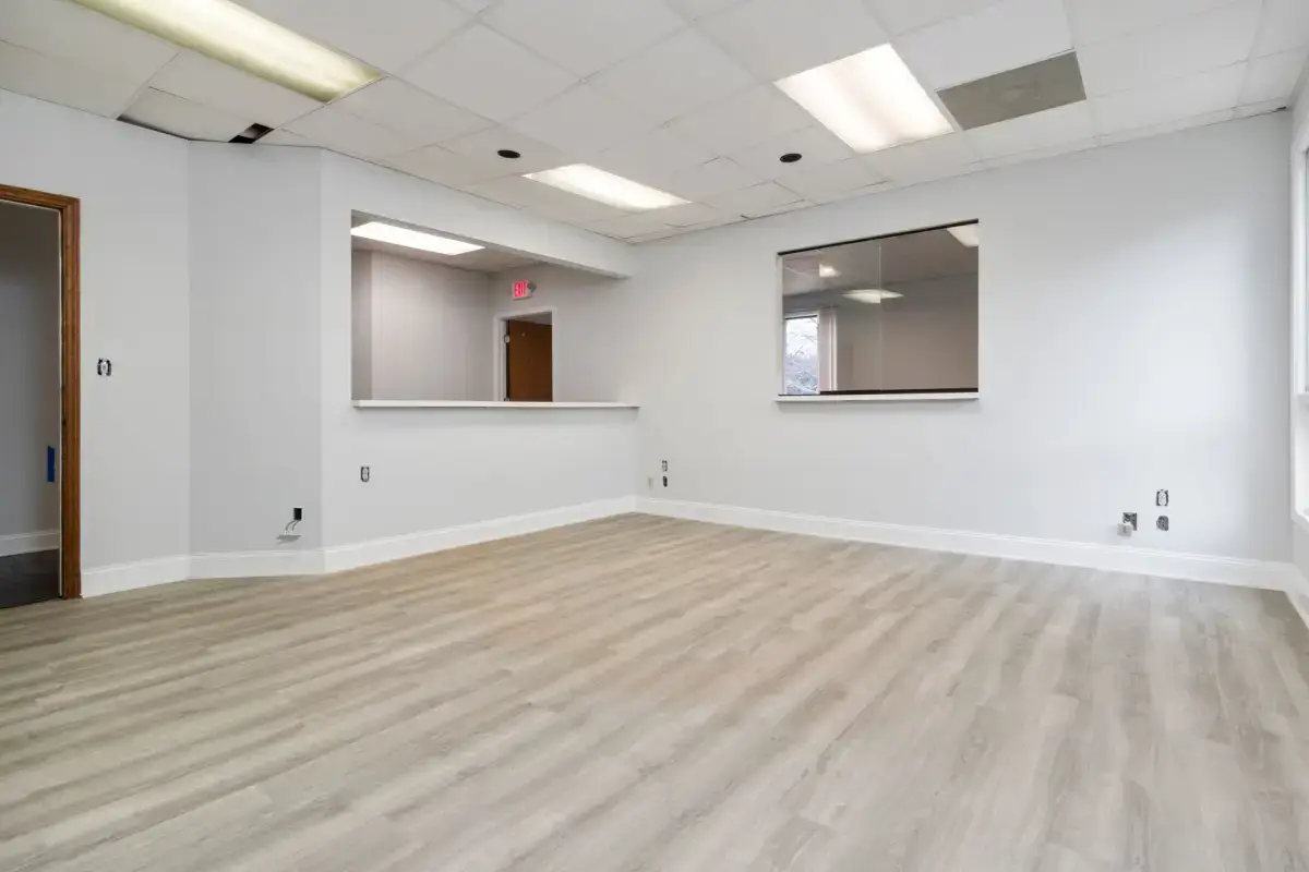 Finished commercial interior under the even lighting that reveals a surface rather than flattering it