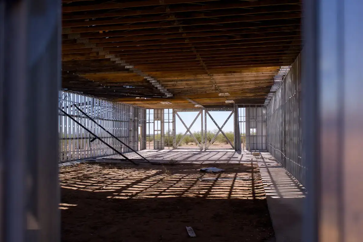 Metal framing running to the underside of the deck in a commercial space