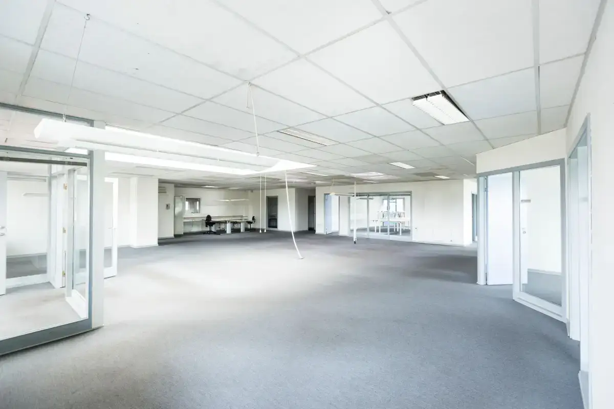 Office space with partitions and glazing, where repairs have to be staged around occupancy