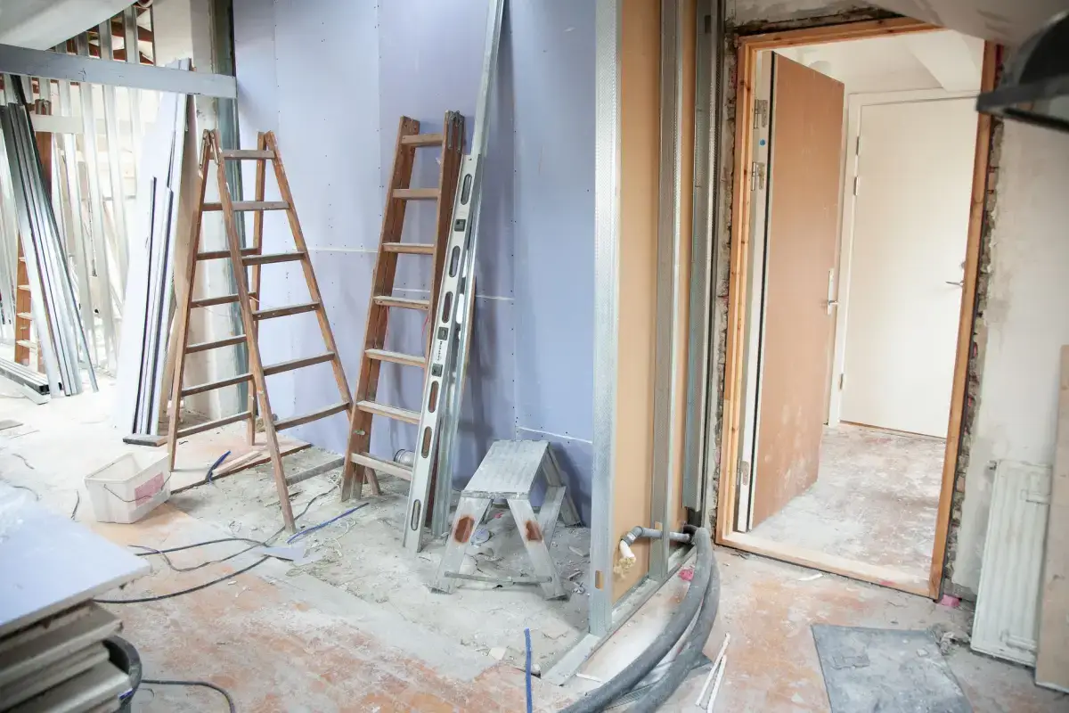 Room sheeted and contained with fixtures removed, set up before ceiling texture is scraped