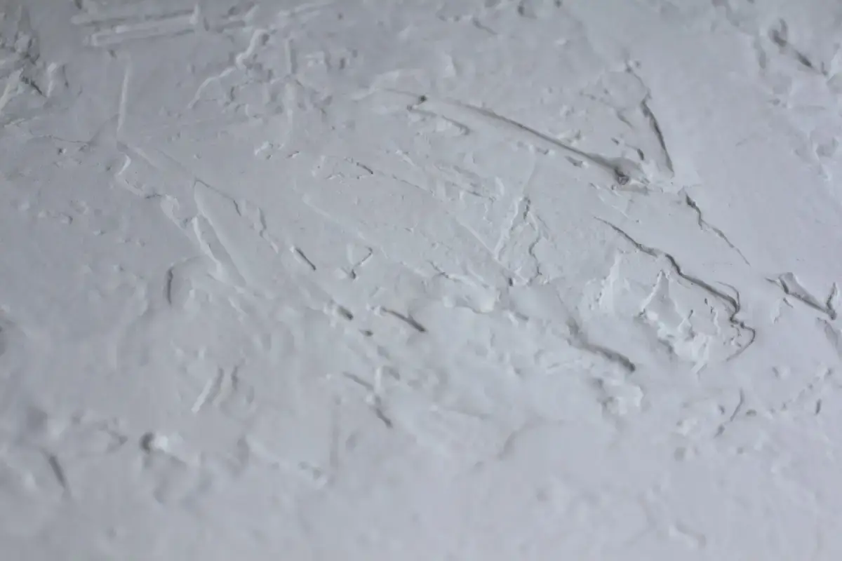 Textured popcorn ceiling surface before removal work begins in a Davenport home