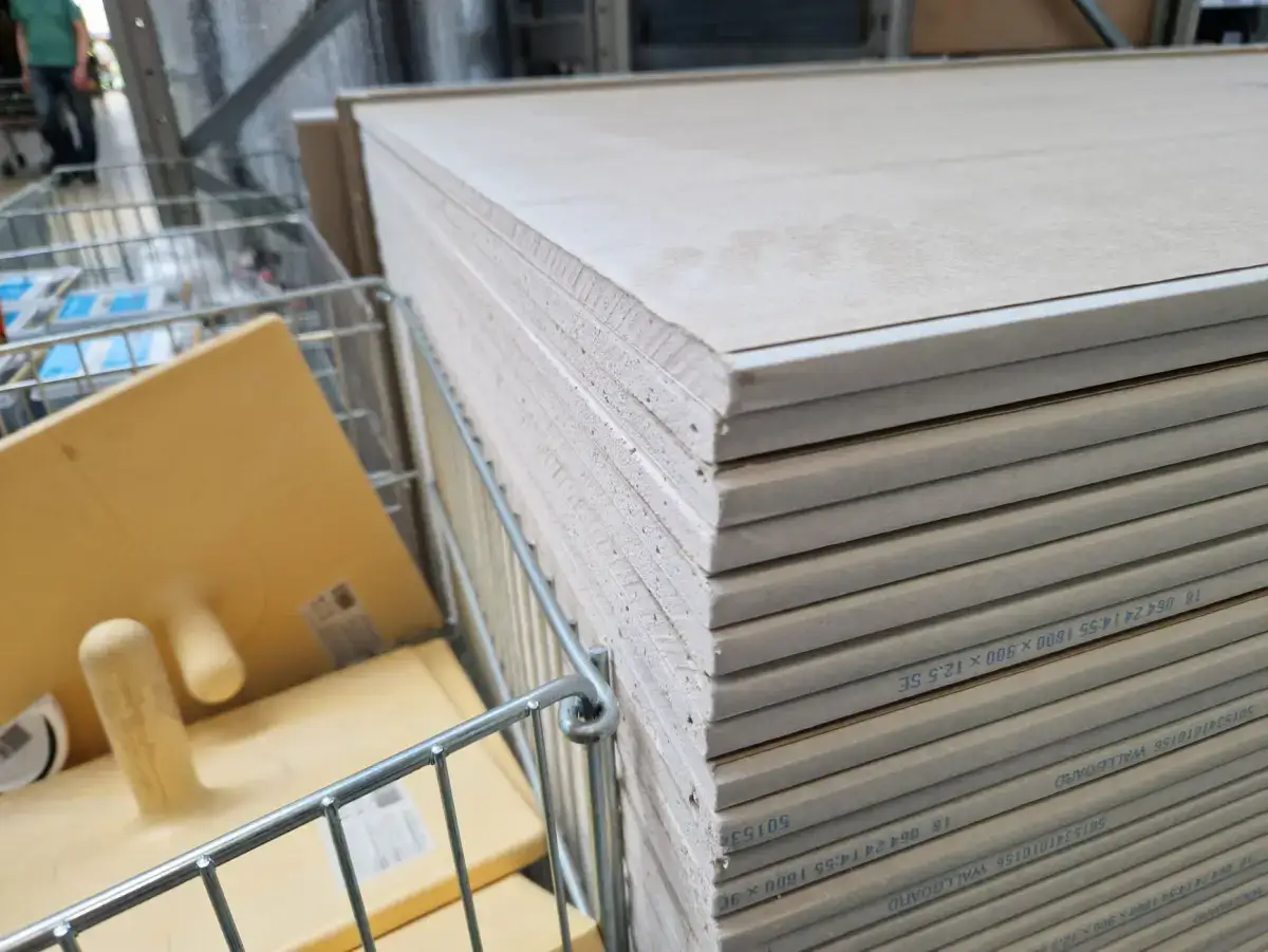 Drywall panels delivered and stacked on site ahead of a tenant fit-out
