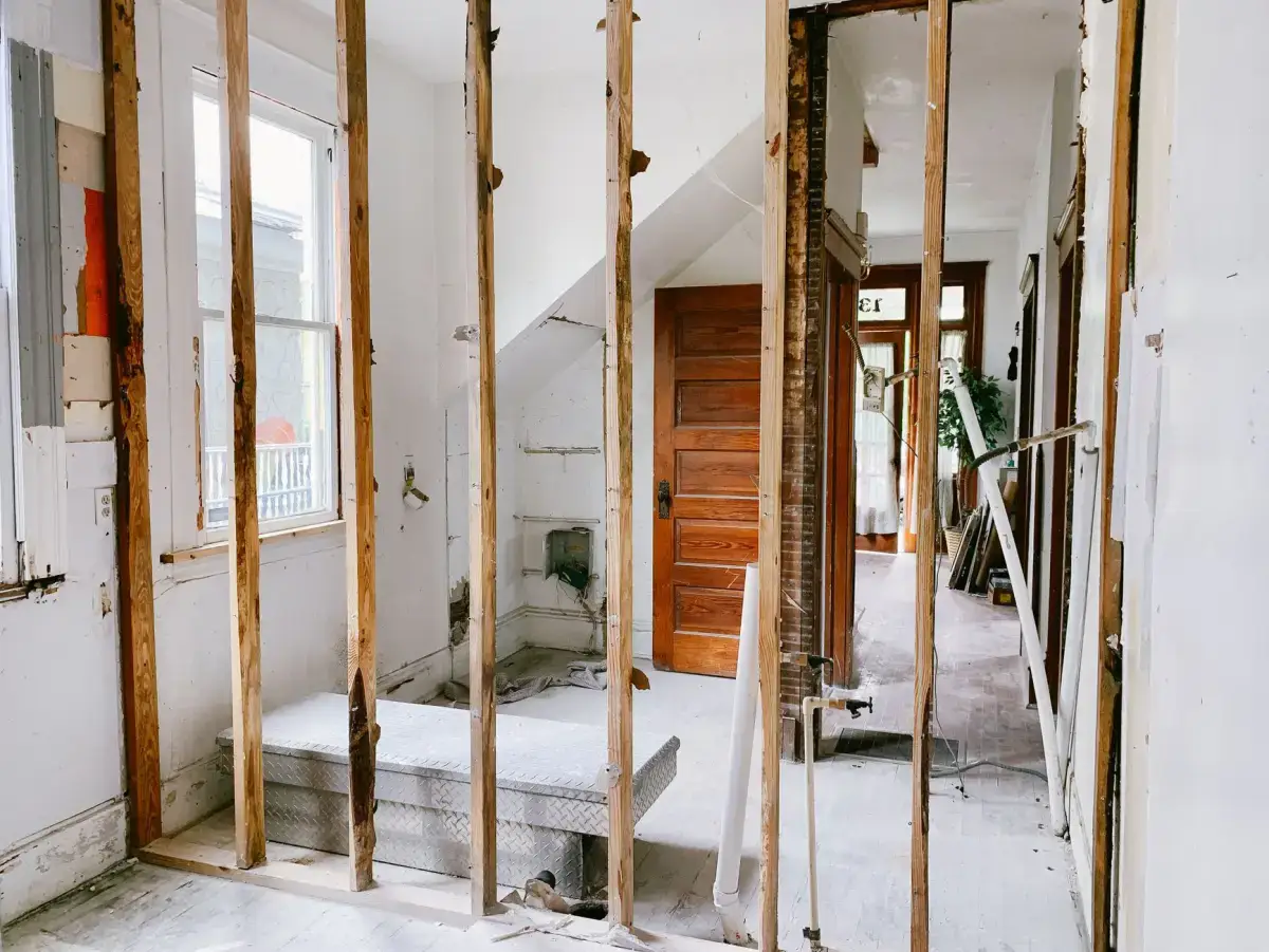Wall framing left exposed after damaged board was removed, checked for dryness before reboarding